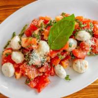 Caprese Salad · Fresh Roma tomatoes, Mozzarella, basil, olive oil & garlic