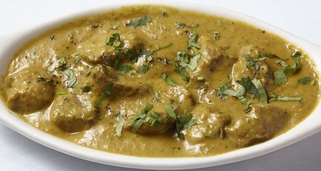 Lamb Taj Curry · Boneless lamb prepared in a flavorful curry sauce.