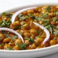 Chana Masala · Chickpeas slowly simmered in a thick gravy like sauce.