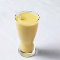 Mango Lassi · Fresh mangoes blended with milk, yogurt, and sweetened.