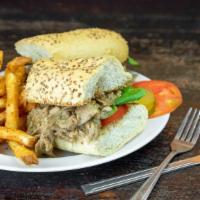 Roast Beef Po-Boy · Homemade roast beef in delicious debris gravy, dressed with lettuce, tomatoes and pickles an...