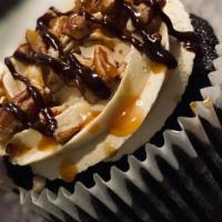 Turtle Delight · Rich chocolate cake filled with scratch made caramel, topped with pecans, caramel and ganache