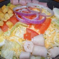 Chef Salad · Lettuce, Tomato, Red Onions, Shredded Cheese, Eggs, Seasoned Croutons,  Ham, and Turkey.