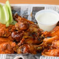 Traditional Wings (10) · 10 mouthwatering traditional chicken wings in your choice of sauce. Served with 2 cups of Ra...
