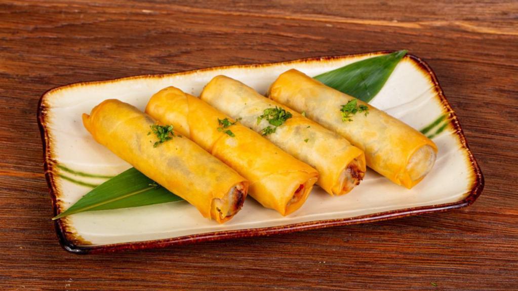 Thai Egg Roll · Deep fried vegetable egg rolls filled with mixed vegetables and clear vermicelli noodles. Served with sweet chili sauce.