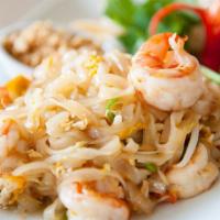 Pad Thai · Thin rice noodles stir fry with egg, beansprouts and spring onions. Alongside with crushed p...