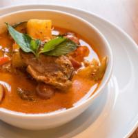 Roasted Duck Curry · Mild. Roasted boneless duck in red curry with coconut milk, pineapple, tomatoes, bell pepper...