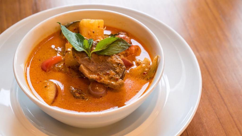Roasted Duck Curry · Mild. Roasted boneless duck in red curry with coconut milk, pineapple, tomatoes, bell peppers, basil leaves
