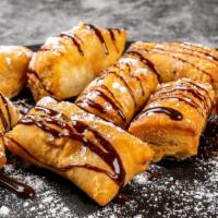 Nutella Poppers · Nutella filled blgnes deep fried and topped with powdered sugar served with cinnamon cannoli...