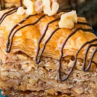 Baklava · Traditional dessert, filo dough filled with walnut, pistachio, and cinnamon.