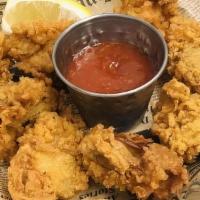 Oyster Basket (10) · Served with th option of cajun fries, sweet potato fries, or regular friess