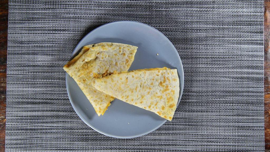 Quesadilla · Beef or chicken served with sour cream, green sauce and pico de gallo.