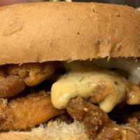 Fried Chicken Sandwich · Vegan Fried Chicken, vegenaise, ranch dressing on wheat bun.  Served with fries.