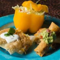 Flautas · Three deep fried flour tortillas wrapped with chicken and deep fried. served with rice and c...