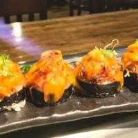 Volcano Roll · Crunchy crab inside and spicy crab, scallop & spicy mayo on top.
