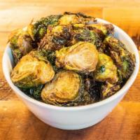 Crispy Brussels Sprouts · Fried brussels tossed in house-made fermented garlic honey with hints of lime.