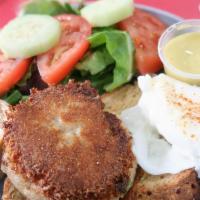 Poached Egg And Crab Cake Passion Salad · Crab Cake served with a poached egg, English muffin, and side salad.