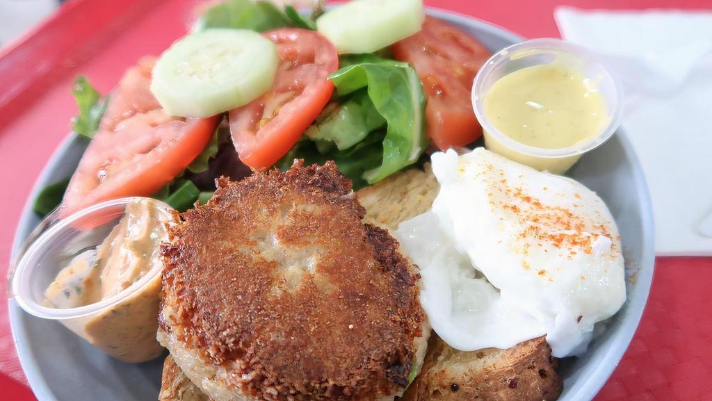 Poached Egg And Crab Cake Passion Salad · Crab Cake served with a poached egg, English muffin, and side salad.