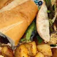 Vegan Crab Cake  Po Boy · Two vegan crab cakes served on a po'boy with choice of grilled potatoes or side salad.