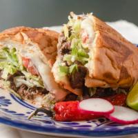 Torta · Your choice of meat served on a Mexican bun topped with lettuce, tomato, avocado, and sour c...
