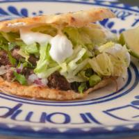 Gorditas · A small corn dough cake filled with your choice of meat topped with cheese, lettuce, onions,...