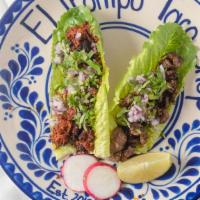 Taco Verde · Your choice of meat served in a romaine lettuce leaf topped with cilantro and onions.