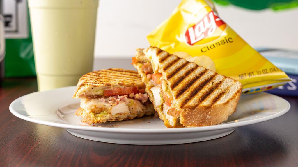 Panini · Pepperoni pizza, chicken parm, pesto chicken, veggie, and chicken bacon tomato with avocado-lime sauce, served with chips.