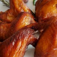 Chicken Wings · Marinated in the secret sauce for 24 hours and then Coal roasted jumbo wings topped with car...