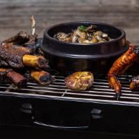 Bbq Of Bones · The perfect trio of 24 hours marinated and grilled lambchops, roasted chicken wings with ros...