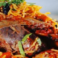 Slow Cooked Lamb Shank · Slow cooked lamb shank with Mediterranean spices. Served with rice