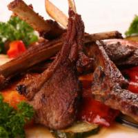 Lamb Chops Kebab · Serving with home style potatoes, marinated onion grilled vegetables and lavash