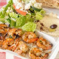 Shrimp Kebab · served on rice with hummus and Greek salad. (no tails and bite size instead of large).