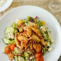 Large Greek Salad · Mixed greens, tomatoes, cucumbers, feta, olives and onions. Meat or veggie Chicken Shawarma,...