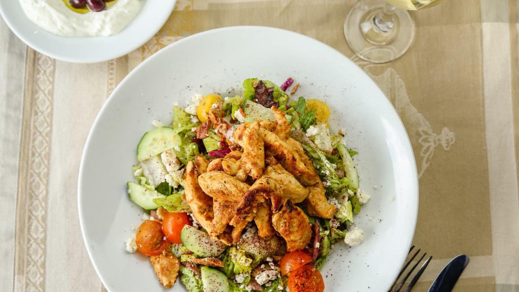 Large Greek Salad · Mixed greens, tomatoes, cucumbers, feta, olives and onions. Meat or veggie Chicken Shawarma, Gyro, Falafel, or Crispy Brussel Sprouts, Beef Shawarma, Shrimp for an additional charge.
