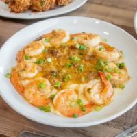 Shrimp & Grits Plate · A bowl of creamy grits topped with BBQ shrimp.