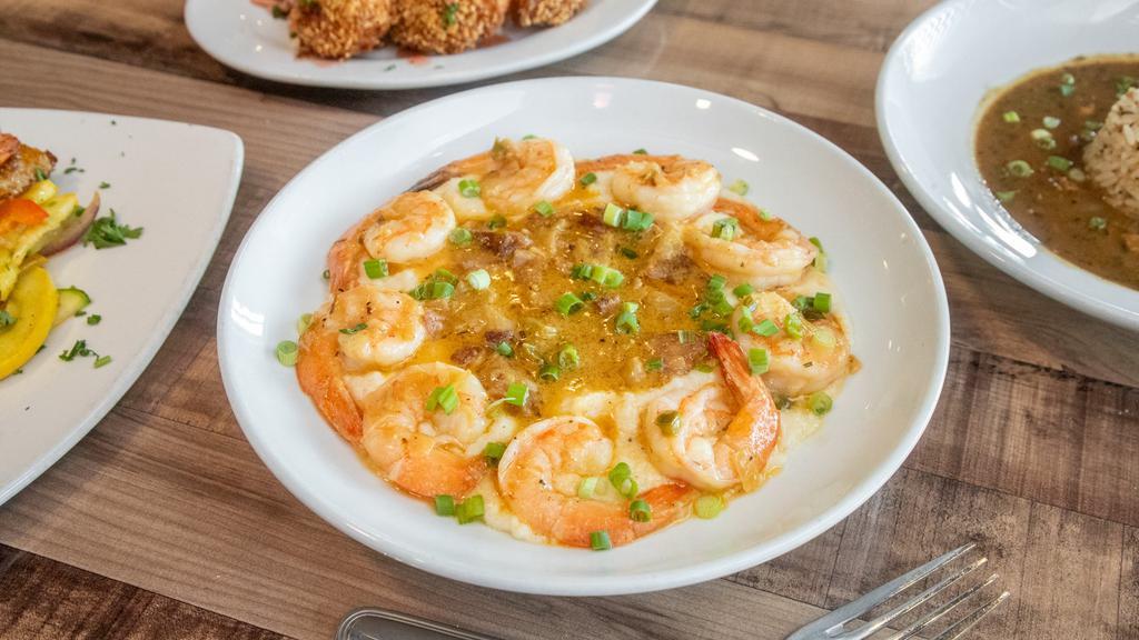 Shrimp & Grits Plate · A bowl of creamy grits topped with BBQ shrimp.