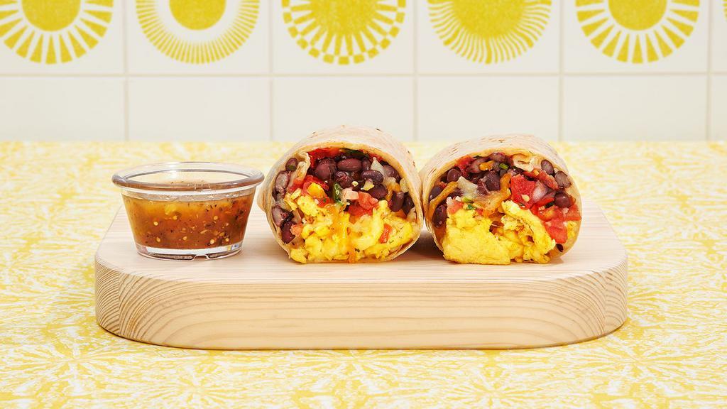 South Of The Border Breakfast Burrito · Two scrambled eggs, pico de gallo, black beans, and melted cheese wrapped in a fresh flour tortilla.