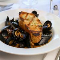 Steamed Mussels · Smoked Pancetta, Tomatoes, White Wine, Garlic Butter.