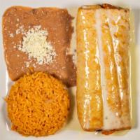 Chimichanga · Chicken or beef topped with cheese sauce served with rice and beans.
