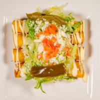 Flautas · 4 chicken flautas topped with lettuce, tomato, onions, Mexican cream, queso fresco and chile...