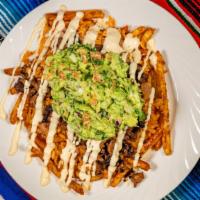 Carne Asada Fries · Fries topped with steak beans, rice, cheese sauce, Mexican cream and guacamole.