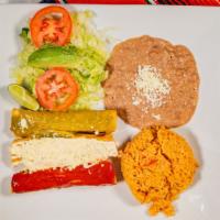 Tacos El Sol · 3 fried tacos topped with red sauce, Mexican cream, queso fresco and green sauce served with...