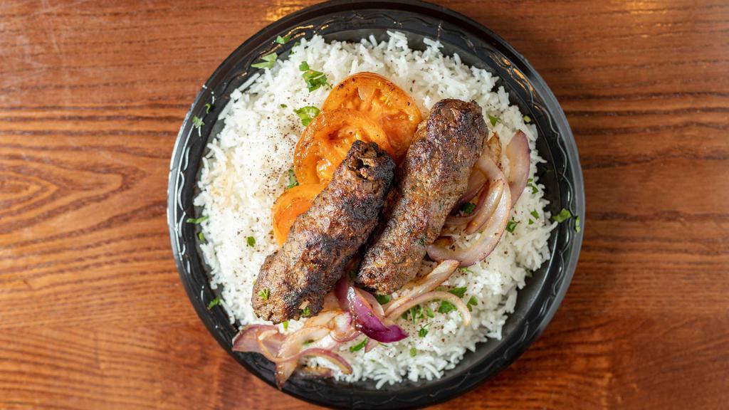 Kaftah Kabob Platter · Seasoned ground beef served with roasted tomatoes and onions. Served with basmati rice, two sides and pita bread. Served with halal chicken and lamb.
