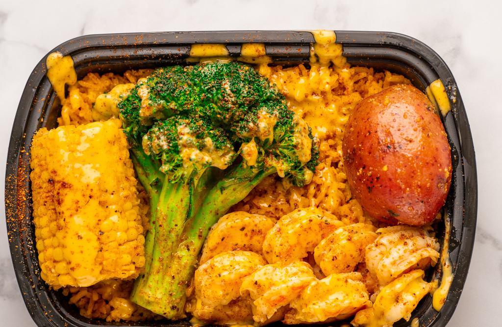 The Grind Pack · 8 Shrimp, 1 Corn, 1 potato on a bed of Dat Rice covered with Memphis Mix Sauce.  You can add a lobster tail, sausage, egg or broccoli.