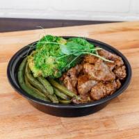 Munch Steak Bowl · Pan-seared tenderloin tips with teriyaki sauce, served over Jasmine rice, with broccoli, and...