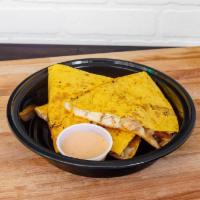 Buffalo Chicken Quesadilla · Chicken breast tossed in spicy buffalo sauce and Buffalo Ranch sauce, grilled in a Jalapeño ...