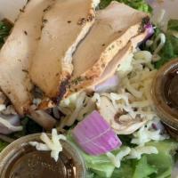 Grilled Chicken Salad · Marinated roasted chicken breast and mozzarella served atop a garden-fresh mixture of grape ...