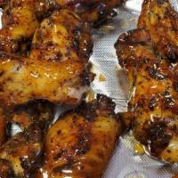 Homemade Saucy Chicken Wings · Sprinkled with our special seasonings and baked to perfection. Tossed with your choice of sa...