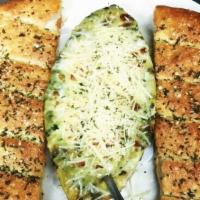 Spinach & Artichoke Dip · A creamy mixture of spinach, artichoke hearts, and cheeses. Served to bubble hot with our fr...