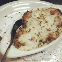 Stuffed Mushroom Caps · Four large mushroom caps brimming with gulf crabmeat stuffing, baked and topped with a cream...